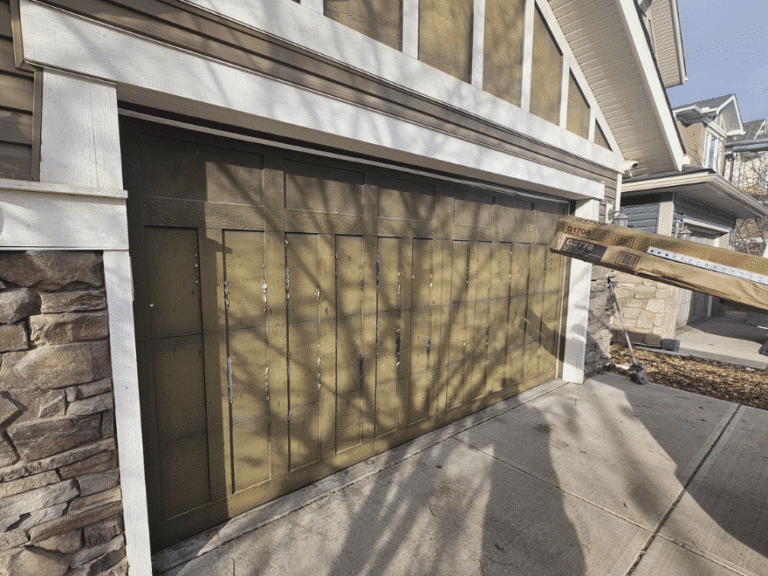Brown double garage door with carriage-style panels and vertical trim.